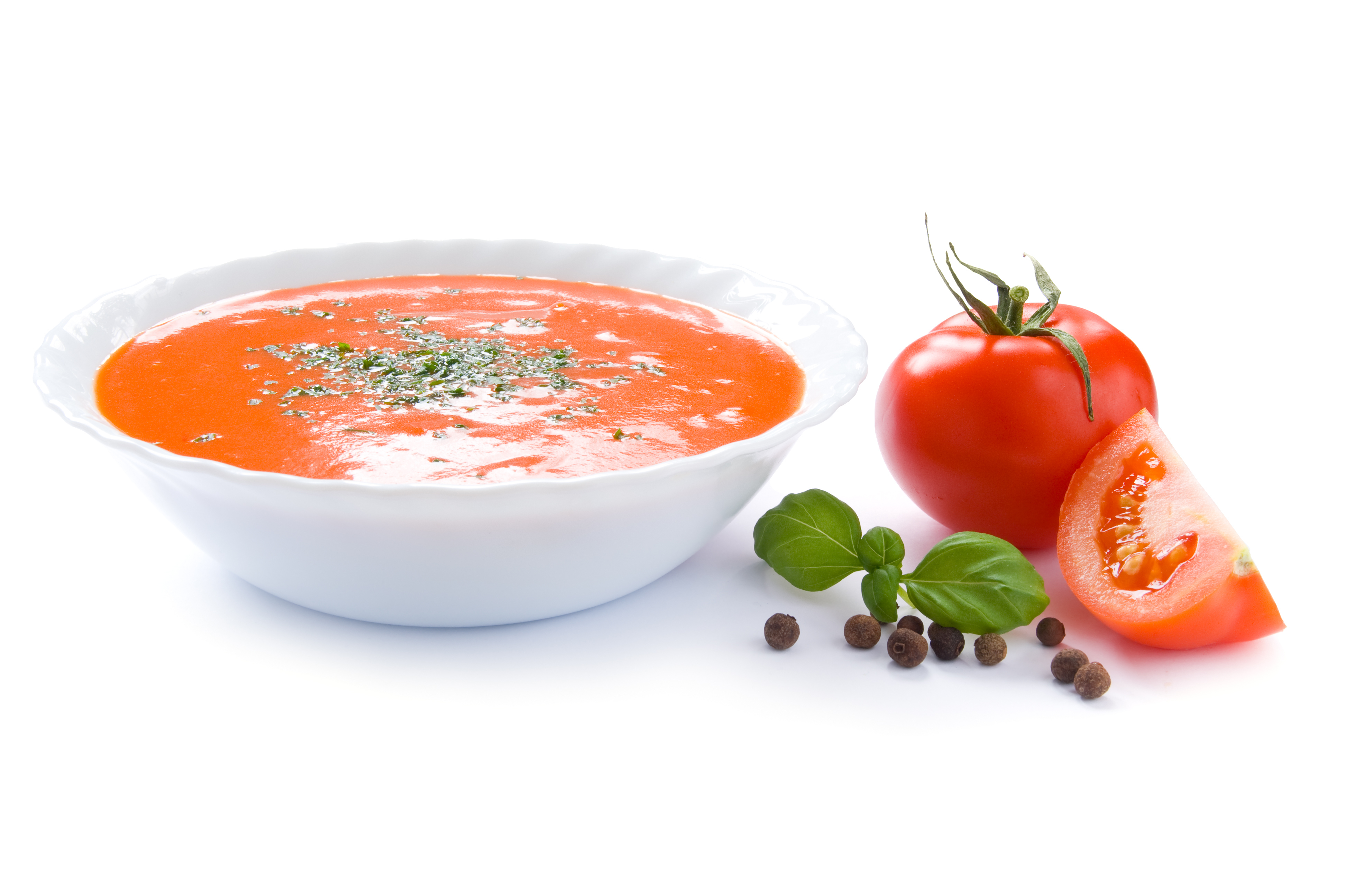 Tomato soup in a bowl isolated on a white background.